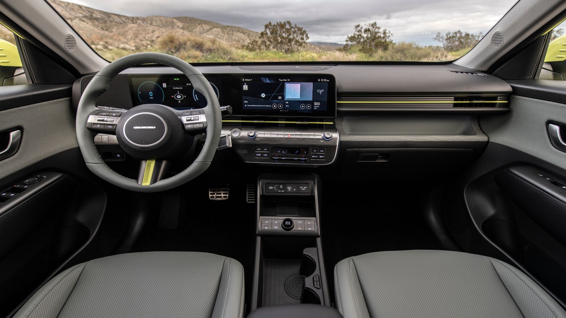 Shot of the dashboard in the 2025 Hyundai Kona Electric showing the steering wheel and two 12.3-inch displays.