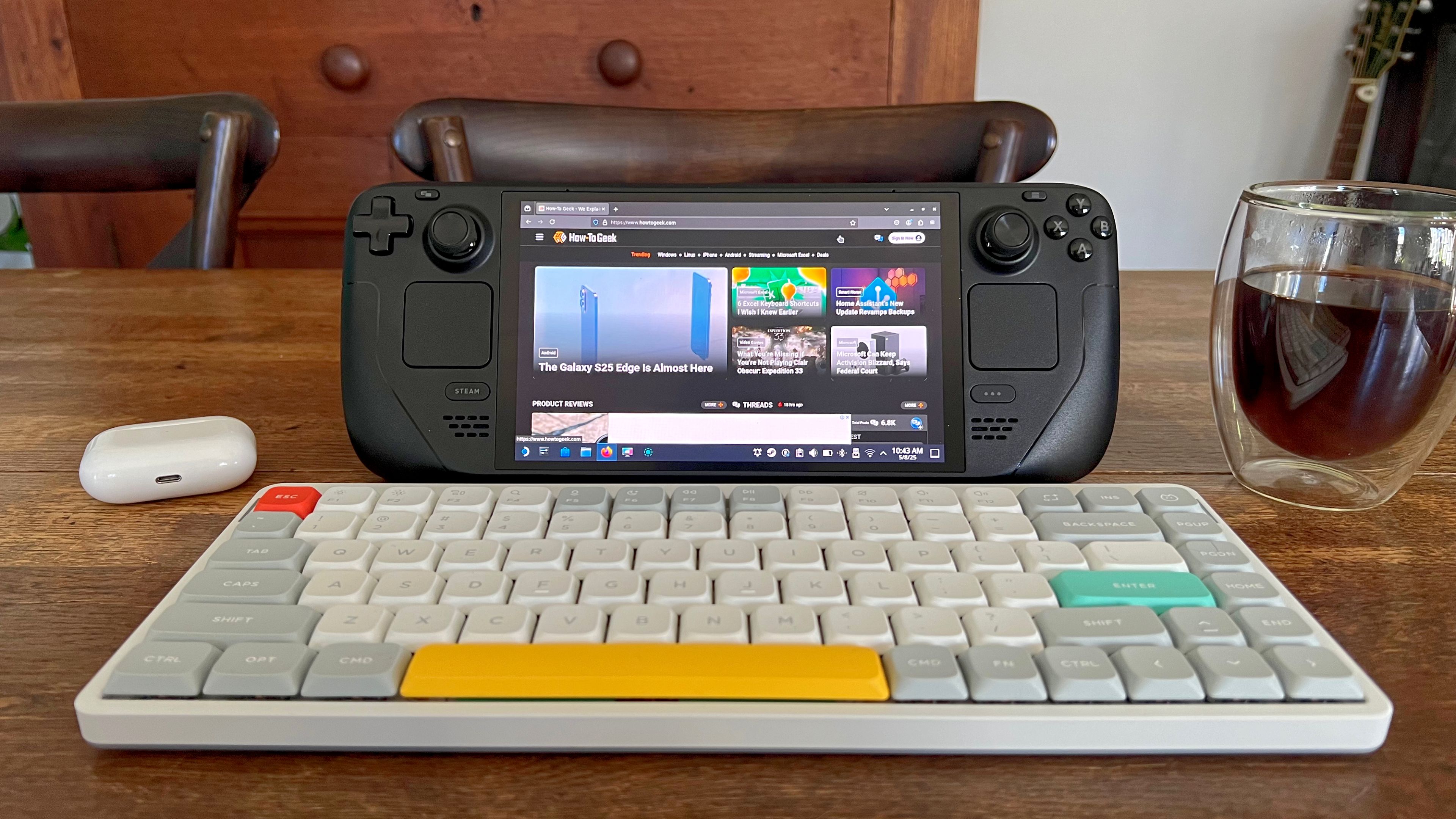 Steam Deck OLED on a table with a NuPhy Air75 mechanical keyboard in Desktop Mode.