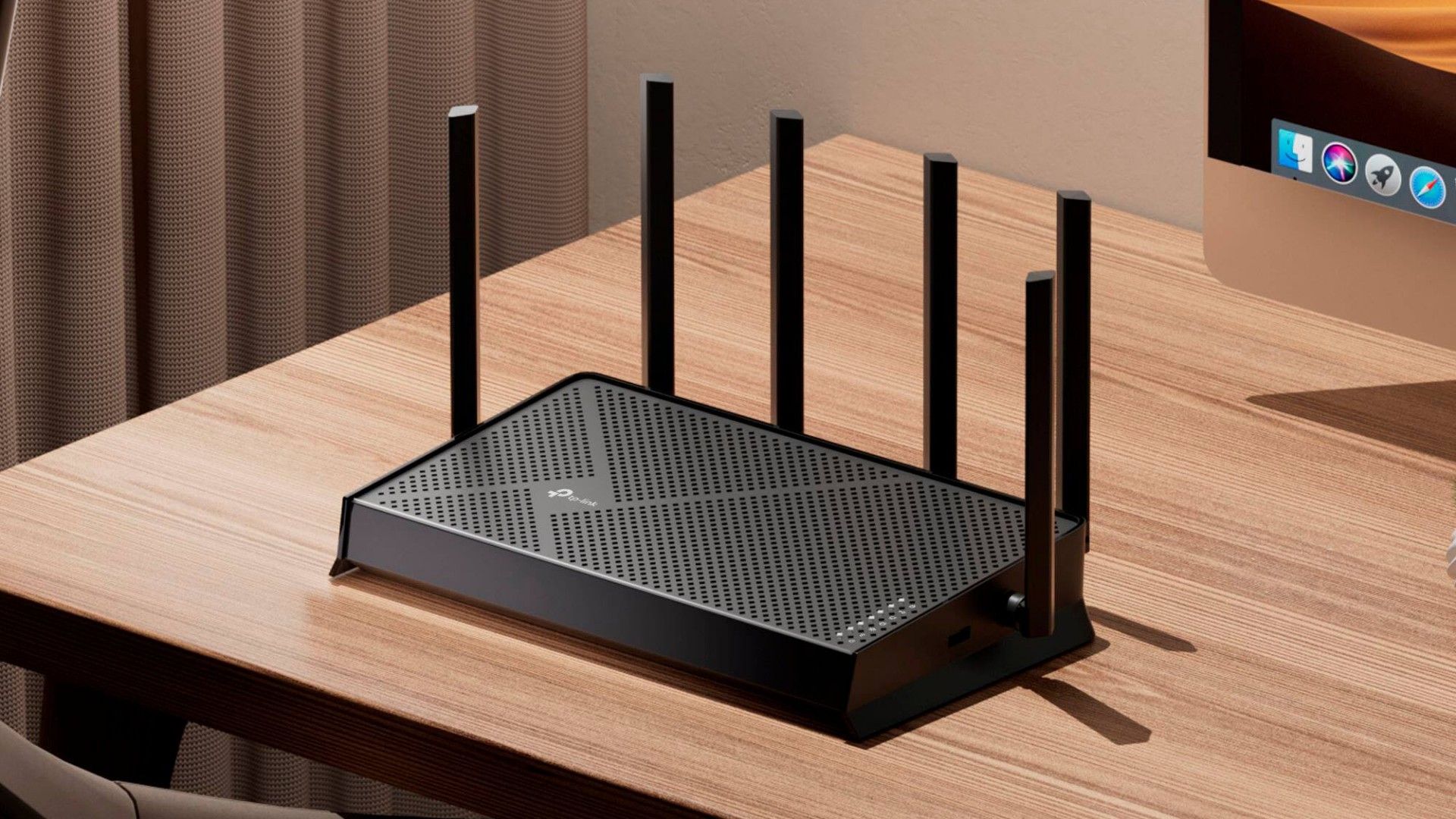 TP-Link Archer BE9700 Tri-Band Wi-Fi 7 router on a table.
