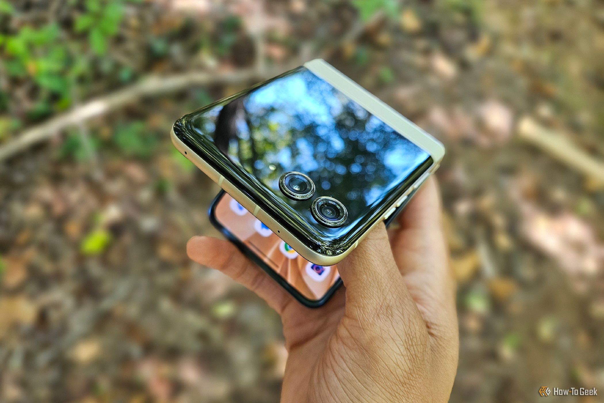 A hand attempting to unfold a Motorola Razr 2024.