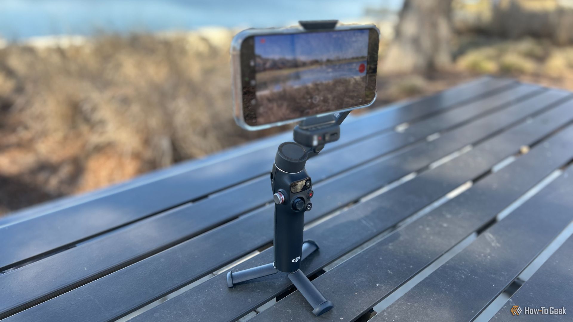 The DJI Osmo Mobile 7p on an outdoor table. 