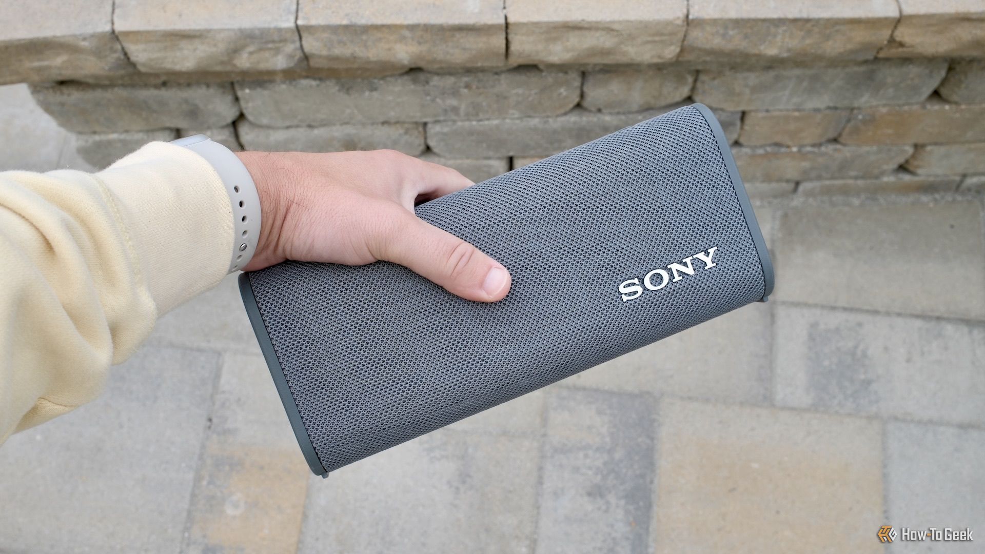 Sony ULT Field 3 speaker being held in a hand.