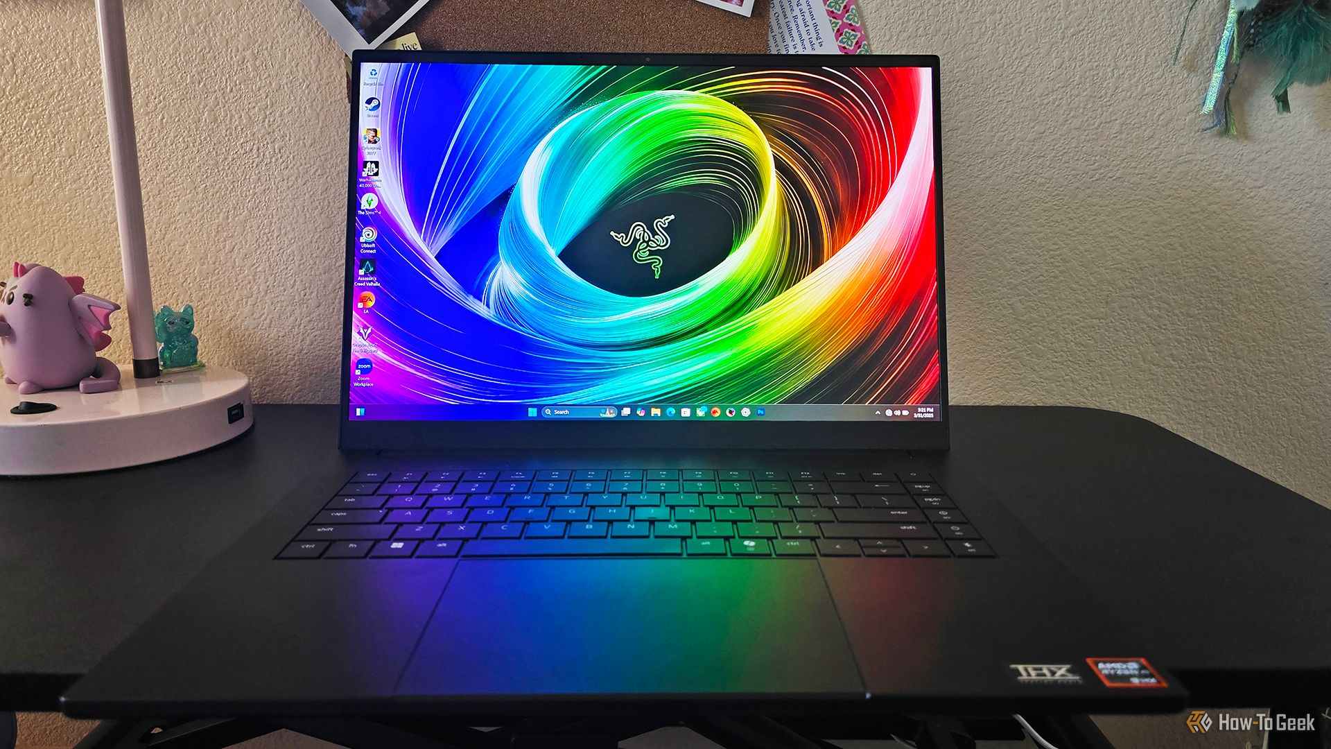 The Razer Blade 16 2025 gaming laptop sitting open on a desk.