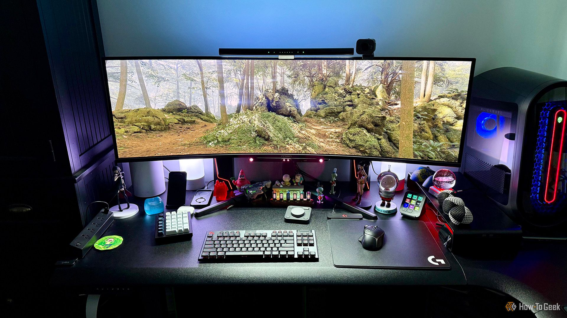 INNOCN 49Q1R 49-Inch OLED Curved Gaming Monitor on a desktop with accessories.