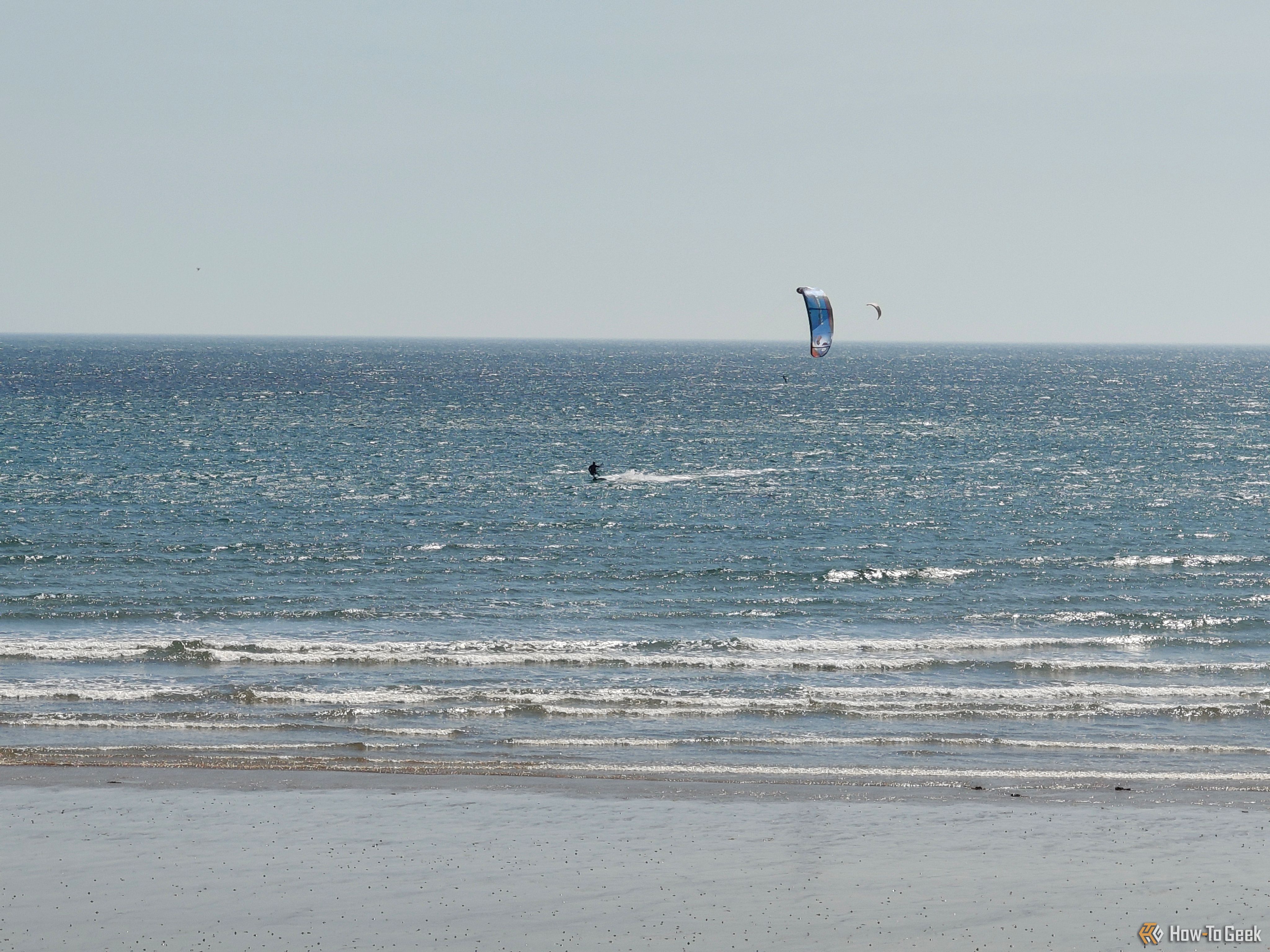 nothing phone 3a pro wind surfer in sea.