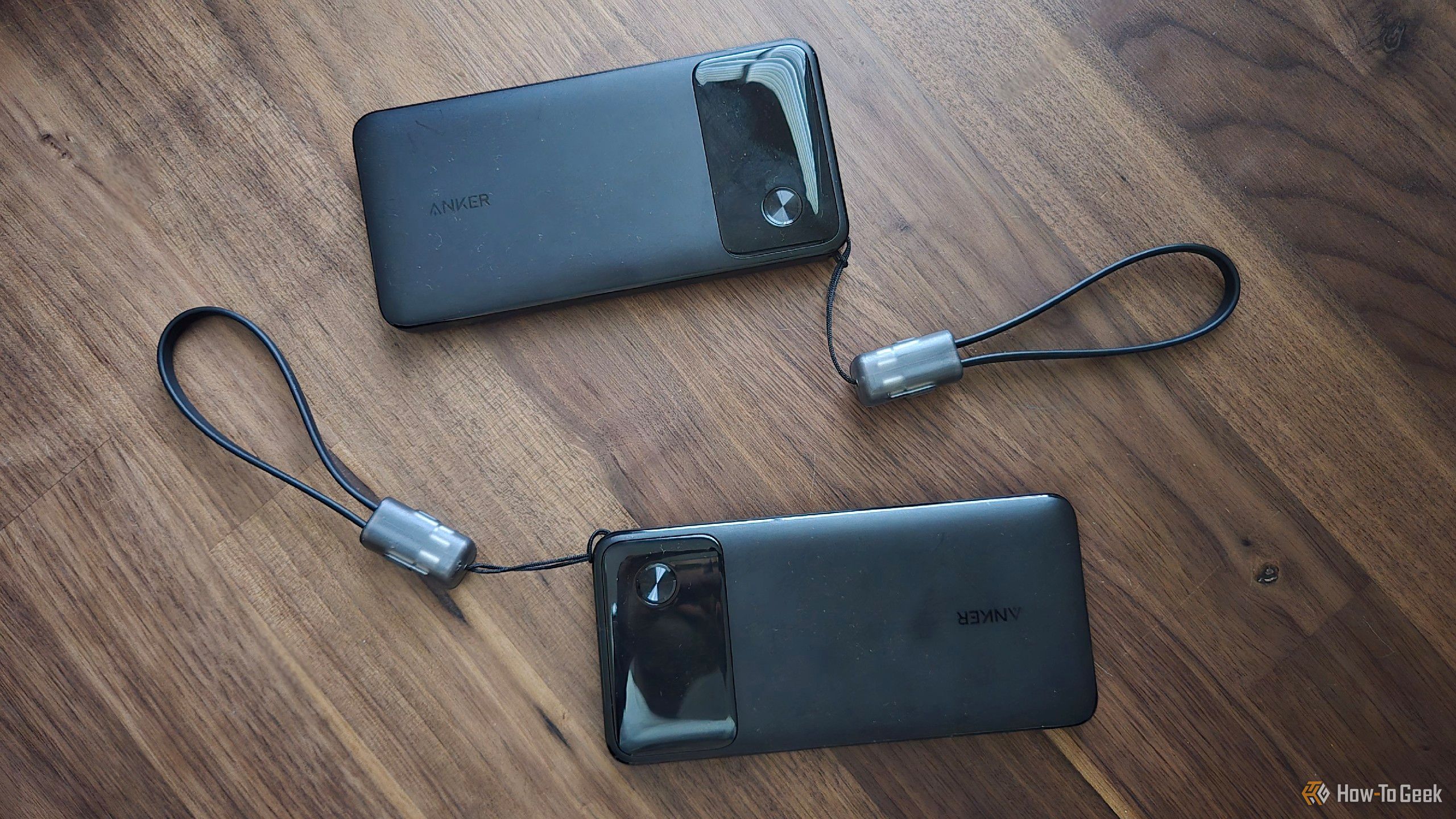 Two Anker portable battery banks on a desk.