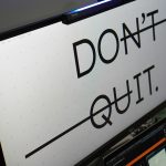 Computer monitor displays 'don't quit.' message