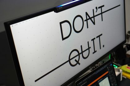 Computer monitor displays 'don't quit.' message