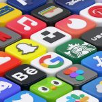 A grid of colorful three-dimensional app icons with various logos on a white surface