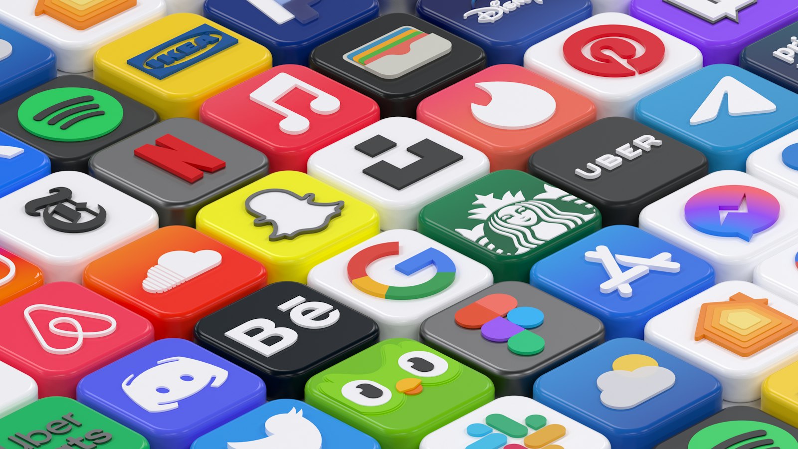 A grid of colorful three-dimensional app icons with various logos on a white surface